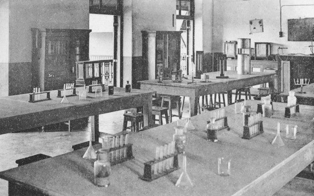 group of four turn of the century amber and clear glass american medical research laboratory "new old stock" reagent bottles with original ground glass stoppers