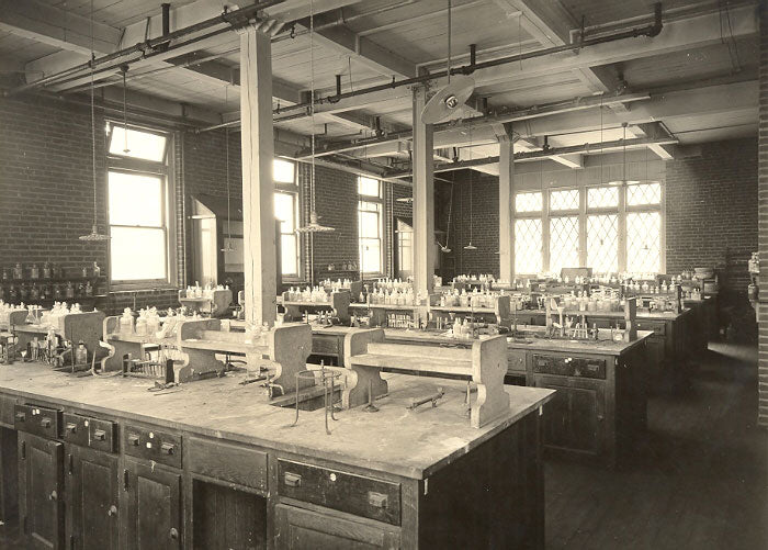 exceptionally rare c. 1916-20 american industrial thoroughly refinished chemistry laboratory compartmentalized workbench with intact swing-out stools