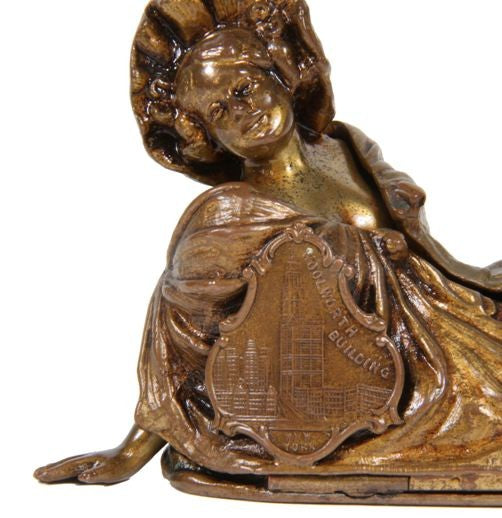 rare early 20th century ornamental bronze-plated reclining erotic female woolworth building souvenir or advertising piece