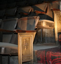 original and intact late 1920's hand-painted american ornamental cast iron monogrammed lawndale theater auditorium seat end with solid birch wood armrest
