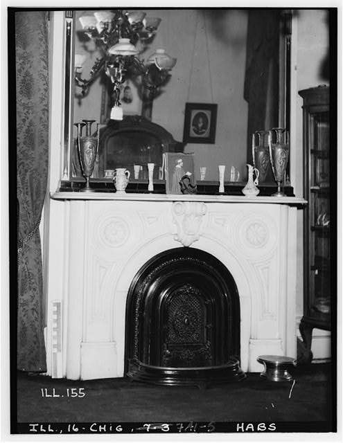 exceptionally ornate 19th century american victorian era black enameled cast iron two-piece interior residential fireplace summer cover