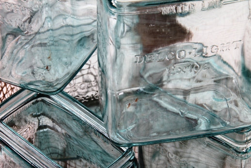 five matching original and remarkably intact early 1920's american industrial exide farm lighting battery "power plant" aqua glass open-ended jars with embossed lettering