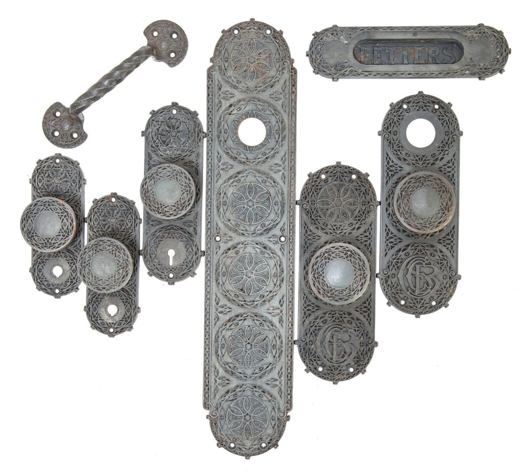 group of four matching louis sullivan-designed ornamental cast iron chicago stock exchange window sash lifts