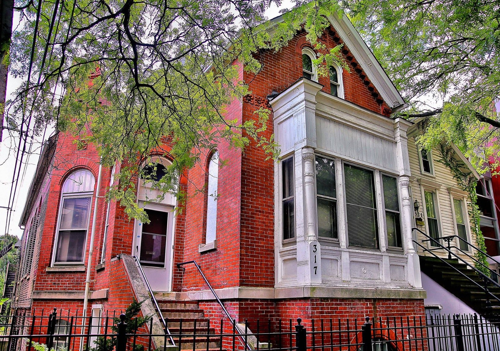 1884-1885 original antique american salvaged chicago red slip glaze northwestern terra cotta keystone with centrally located floral rosette