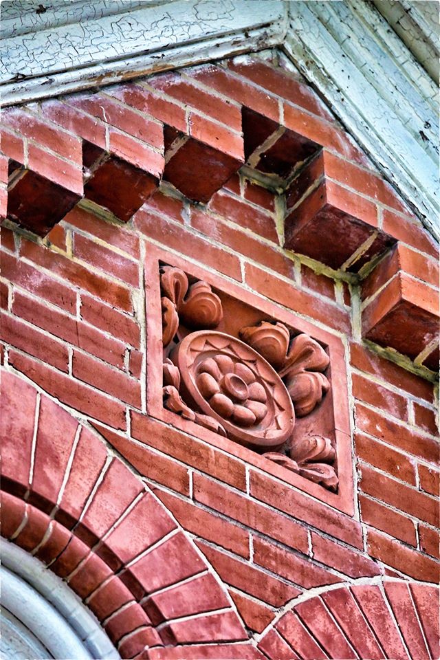 original and intact c. 1885 oversized salvaged chicago ornamental red slip glaze exterior german meeting hall terra cotta panel with with centrally located floral rosette