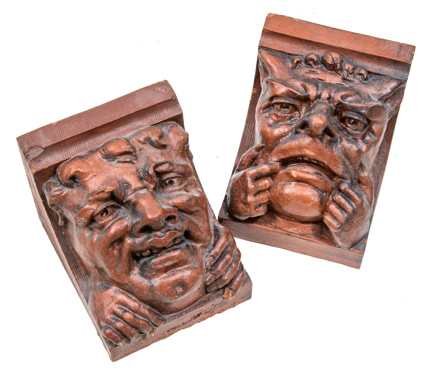 two original red slip terra cotta grotesque corbels salvaged from charles sumner frost's lake front railroad depot