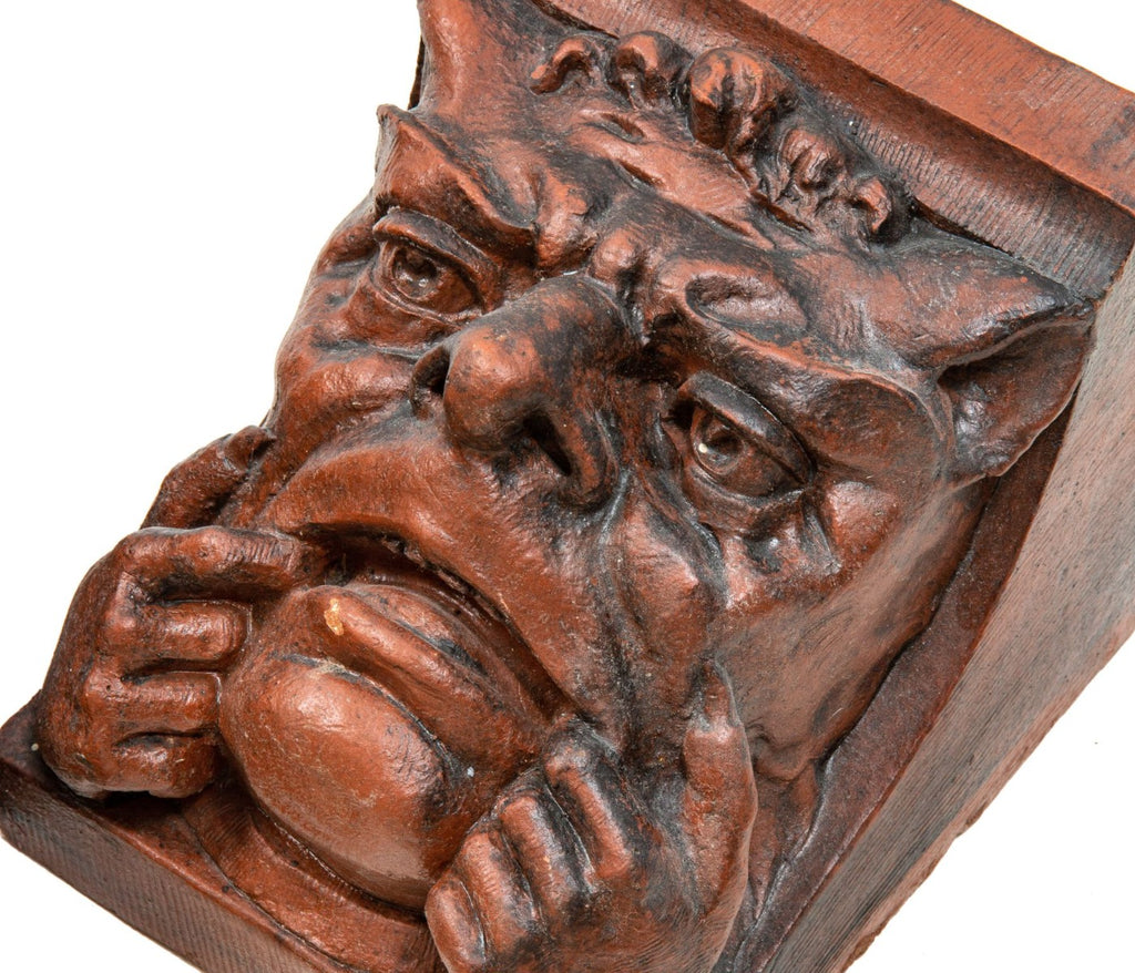two original red slip terra cotta grotesque corbels salvaged from charles sumner frost's lake front railroad depot