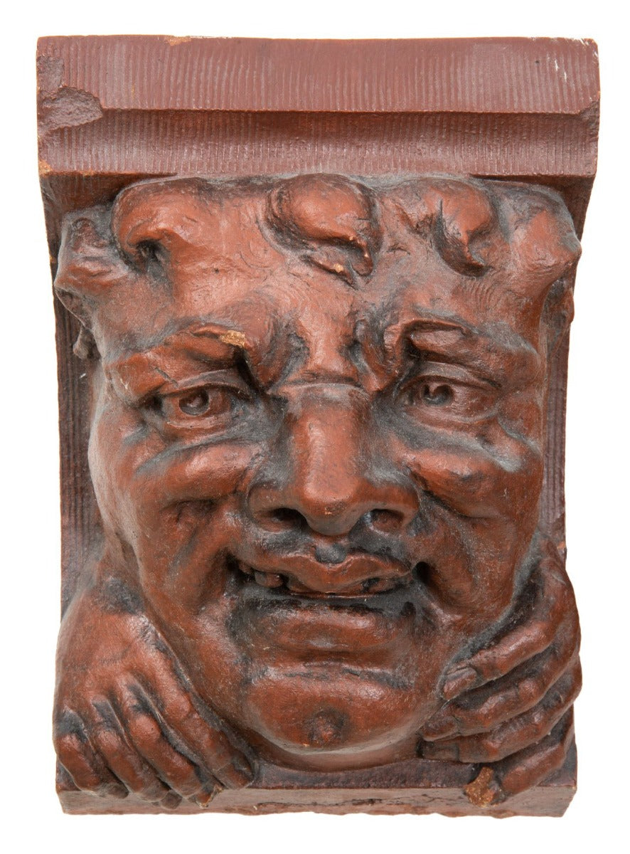 two original red slip terra cotta grotesque corbels salvaged from charles sumner frost's lake front railroad depot