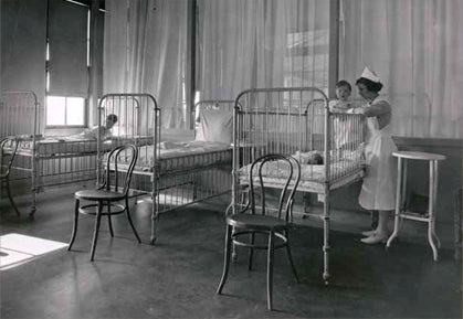 c. early 20th century american intact bedside "murdock" asylum chair comprised of lightweight tubular steel with silver enameled finish