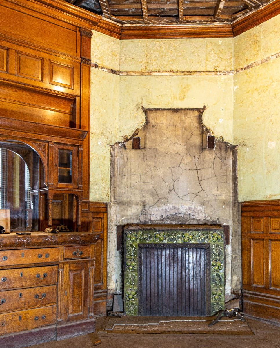 all original and amazingly intact late 1880's deeply embossed fruit and vine green majolica glazed fireplace mantel tile surround