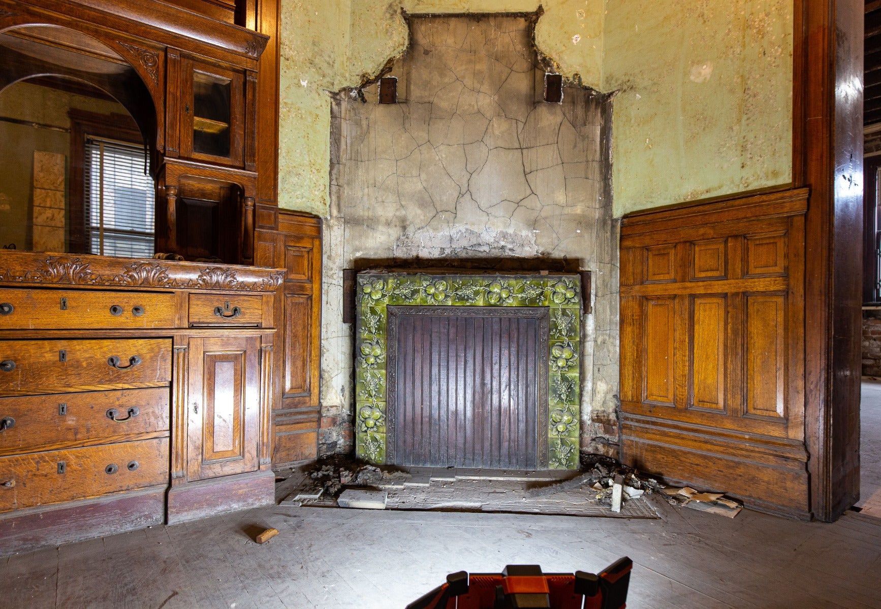 all original and amazingly intact late 1880's deeply embossed fruit and vine green majolica glazed fireplace mantel tile surround