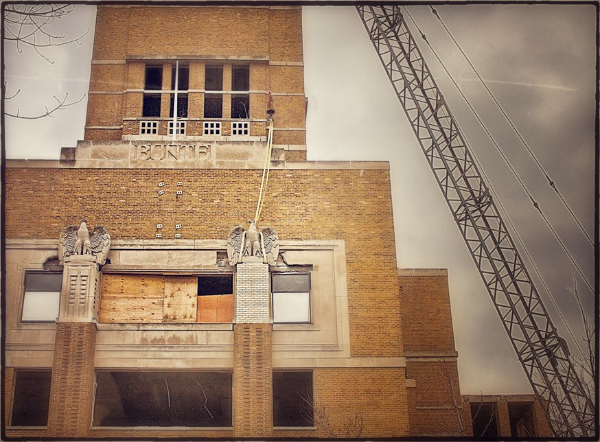 truly remarkable oversized historically-important bunte candy factory administration office tower hand carved c. 1919 spread-winged solid limestone exterior facade eagle