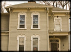 2 matching c. 1870's carved victorian american italianate pine arch top exterior white painted residential window hood keystones