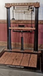 two matching repurposed early 20th century american railroad platform scale column side tables or display stands