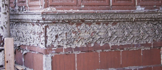 elegantly designed late 19th century ywca building exterior glazed terra cotta entrance surround frieze panel with salmon-colored finish