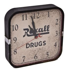 original and fully functional american depression era "rexall drugs" wall-mount electric clock with chrome accent