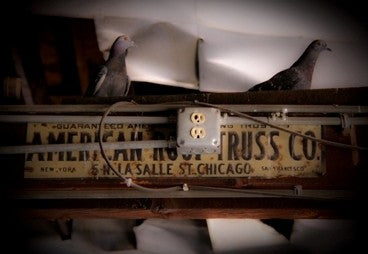 single-sided early 20th century antique industrial original lithographed tin flush mount "american roof truss" sign salvaged from an old foundry building