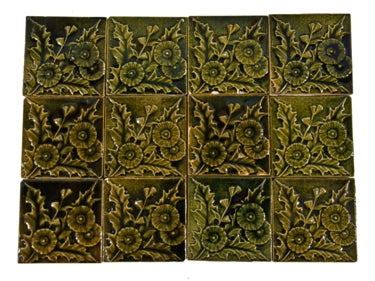twelve original and remarkably intact matching late 19th c. well-crafted antique american salvaged chicago green majolica victorian era fireplace tiles with bold floral motifs