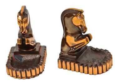 original and remarkably intact matching set of impressive machine age art deco style copper-plated rearing trojan horse bookends