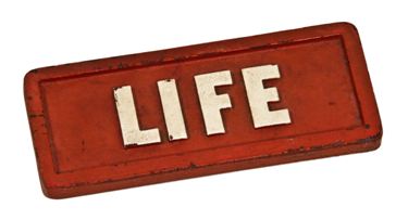original c. 1940's double-sided cast iron life magazine newsstand paperweight