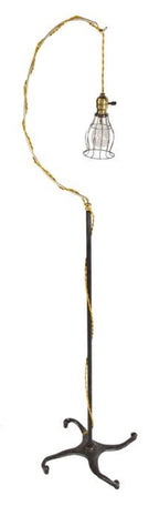fully functional repurposed vintage industrial freestanding "trouble light" reading and/or floor lamp with uniquely designed cast iron four-legged brushed metal base