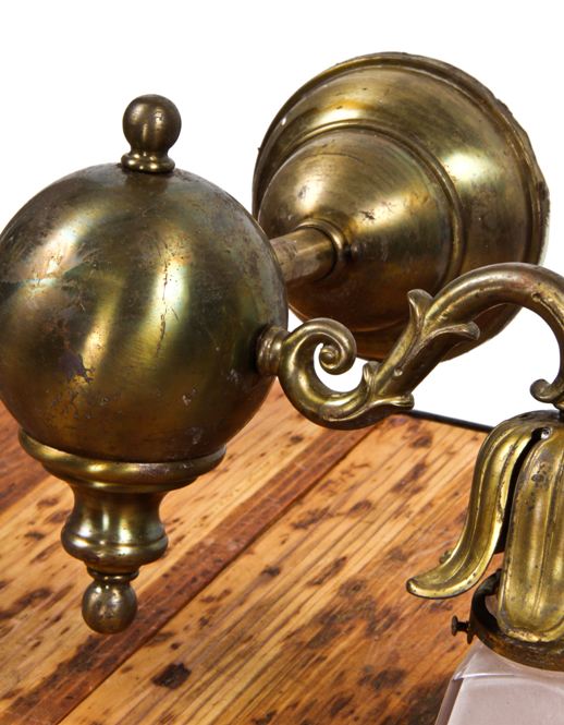 fanciful and fully intact 1910 2-arm dark brass interior residential wall sconce with glass pyramidal shades
