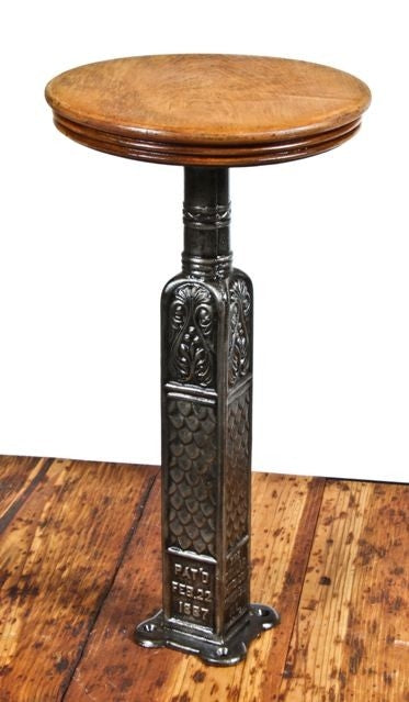 exceptionally rare late 19th century original ornamental cast iron elevator cab swivel stool with intact detachable solid mahogany wood seat