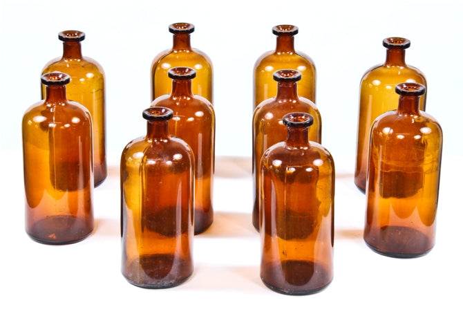 large lot of vintage medical amber colored reagent laboratory bottles with flat bottoms and rolled lip tops