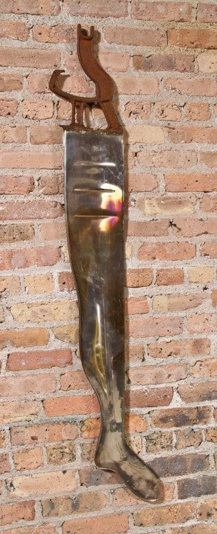 unusual and visually striking antique american industrial highly polished nickel-plated steel garment factory lady stocking leg form