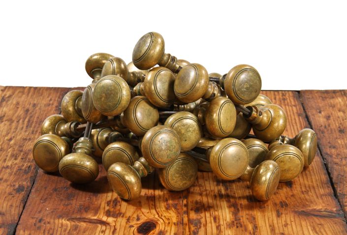 large lot of 100 matching c. 1920's cast brass lakeshore drive athletic club building doorknobs with incised rings