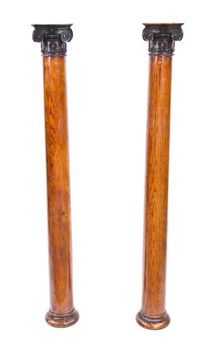 matching late of late 19th century american victorian era solid varnished oak wood interior residential columns with ornamental ionic capitals