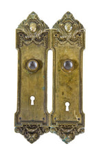 two matching early 20th century ornamental cast brass metal blackstone hotel guestroom doorknob backplates