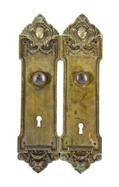 two matching early 20th century ornamental cast brass metal blackstone hotel guestroom doorknob backplates