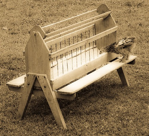 custom vintage c. 1930's depression era industrial stationary chicken or poultry feeder coffee table with four-legged angled steel base