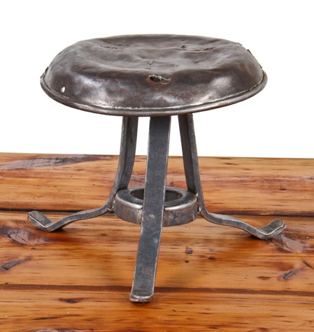 original and intact early 20th century vintage industrial heavy gauge steel three-legged riveted joint milking stool