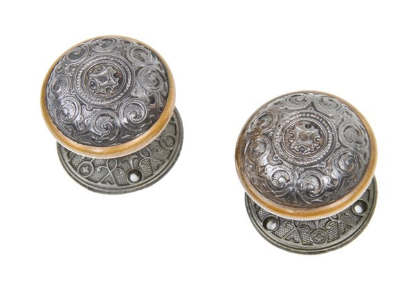 matching set of c. 1870's ornamental cast iron victorian era doorknobs with matching rosettes