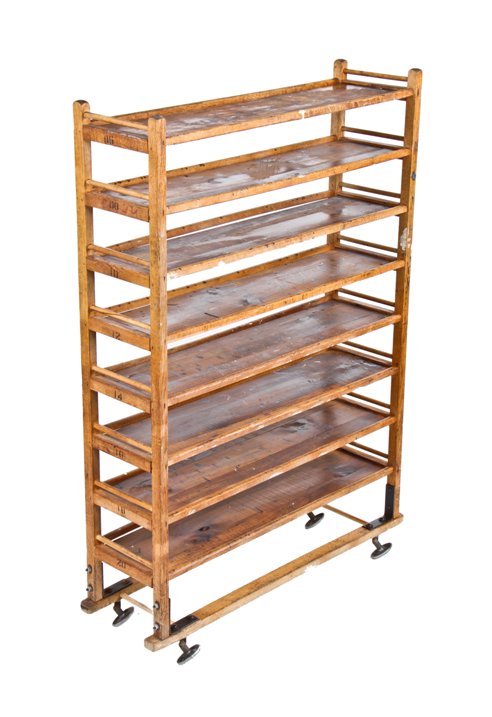original early 20th century national bread company mobile oak wood baker's rack complete with disc-shaped swivel wheels
