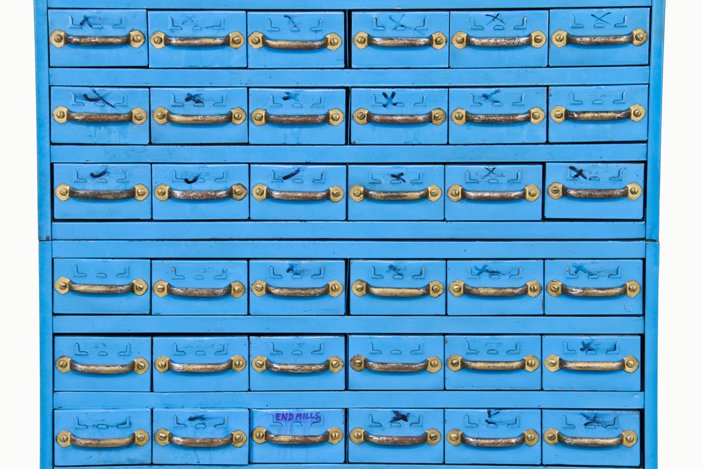 towering stack of c. 1940's american industrial heavy gauge steel "equipto" pull-out drawer cabinets with old blue paint finish