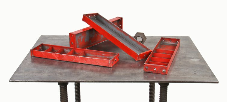 group of four vintage industrial folded and pressed steel compartmentalized "small parts" trays with old red paint finish