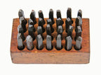 complete set of early 20th century american vintage industrial solid steel machine cut hand letter stamps with original wood block