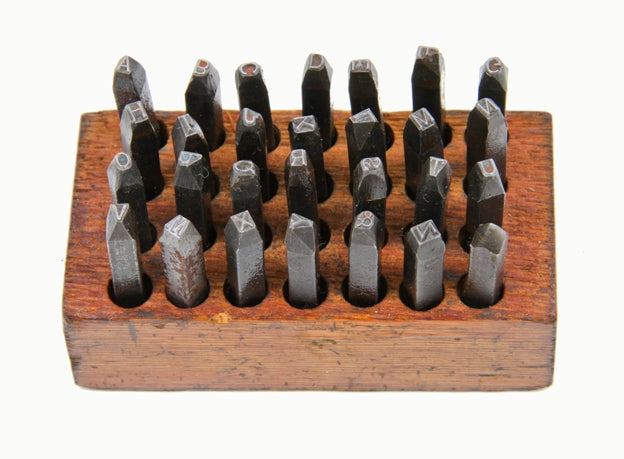 complete set of early 20th century american vintage industrial solid steel machine cut hand letter stamps with original wood block