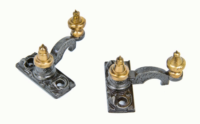 two matching c. 1870's interior residential decorative cast iron double-hung window sash locks with fanciful turned brass metal steeple finials