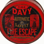 largely intact early 20th century american commercial building wall-mount "davy" fire escape device with original lithographed steel canister