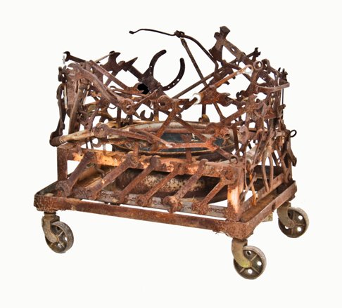 unusual american industrial or steampunk mobile outdoor yard art planter cart with welded joint found objects surrounding a wheel rim