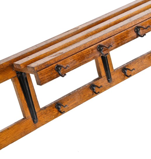 completely intact early 20th century railroad depot wall mount varnished oak wood garment rack with black enameled cast iron hooks