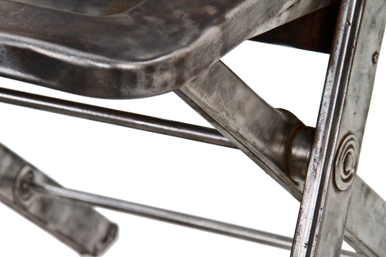 hard to find c. 1920's american industrial heavy gauge folded and pressed brushed steel four-legged portable folding chair