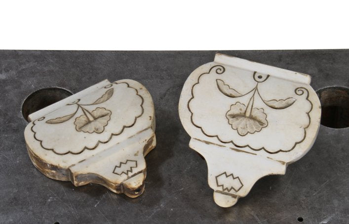 two matching pre-chicago fire interior residential white carrera marble mantel keystones with deeply incised ornament