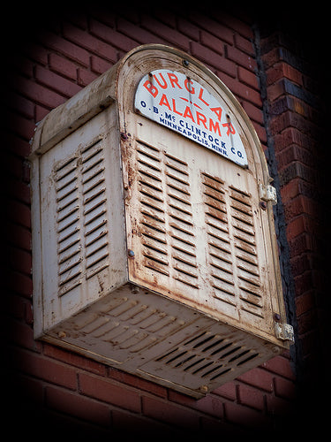 original c. 1930's single-sided die cut steel porcelain enameled "burglar alarm" exterior bank building arched sign
