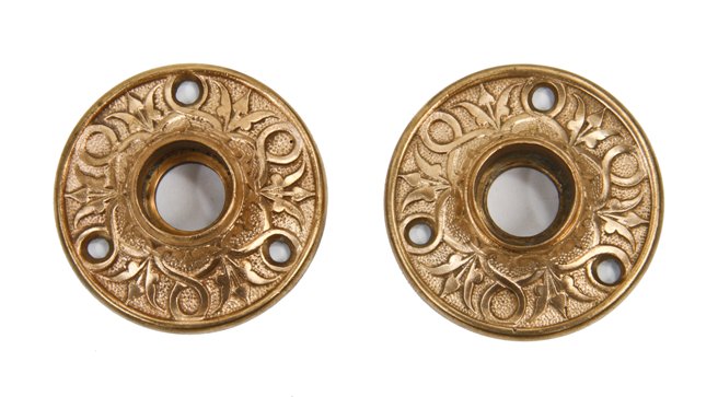 matching set of c. 1870's american victorian era ornamental cast bronze interior residential doorknob rosettes with delicate floral motifs