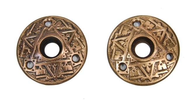 matching set of original antique american victorian era interior residential ornamental cast brass doorknob rosettes
